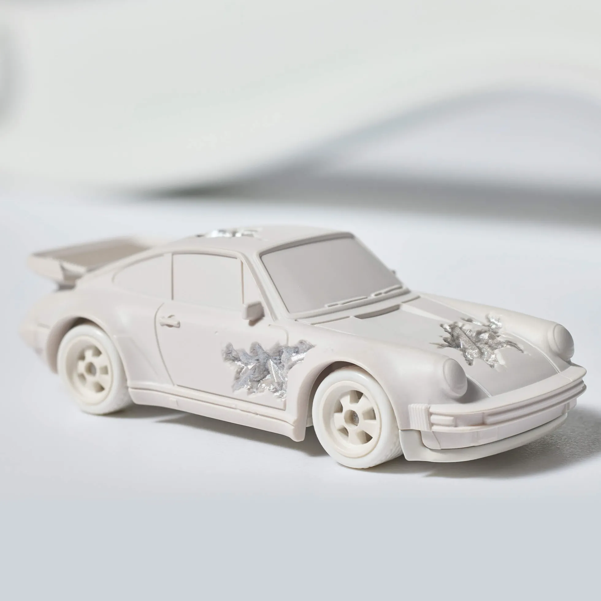 Hot Wheels x Daniel Arsham Eroded Porsche 930 and Rally Case