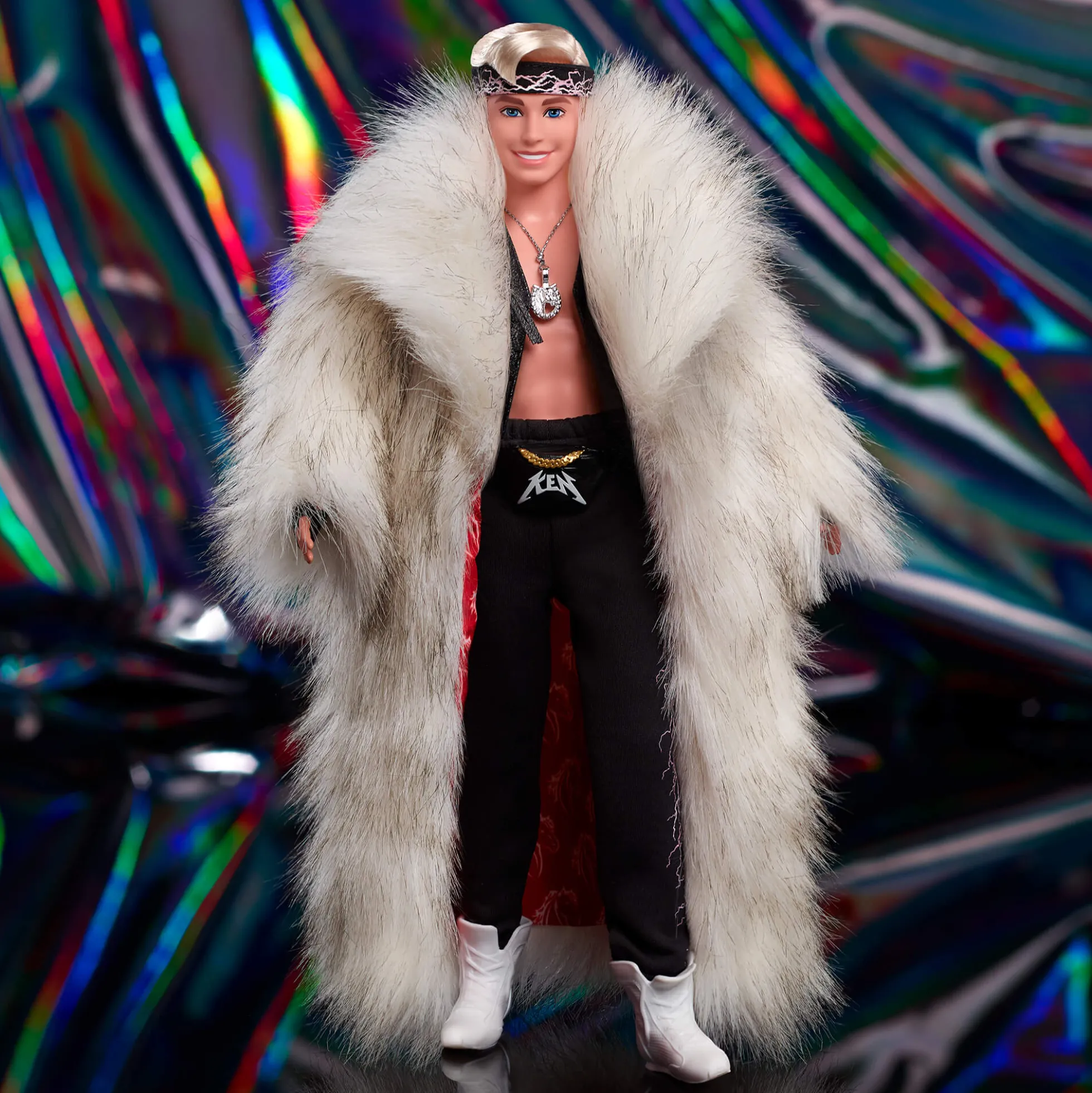 Ken Doll in Faux Fur Coat and Black Fringe Vest – Barbie The Movie