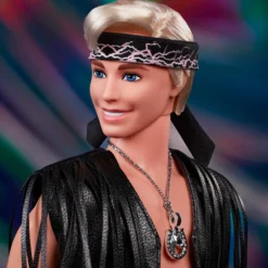 Ken Doll in Faux Fur Coat and Black Fringe Vest – Barbie The Movie